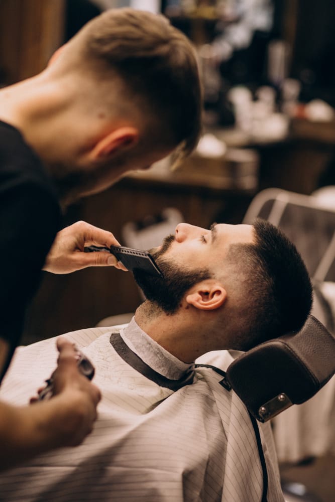 Close-up of a barber detailing a client's cut
